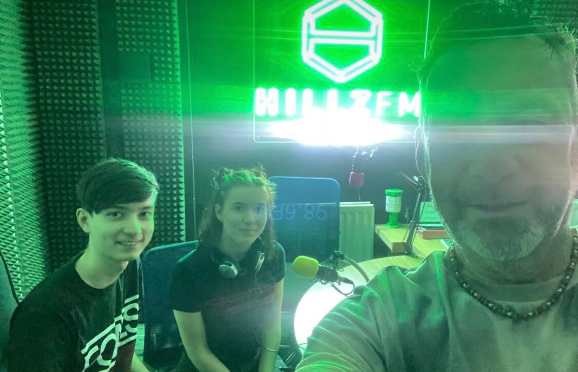 Tom and Emily in the Hillz FM studio with Ricky G